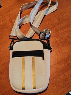 Cream Crossbody Phone Pouch with Gold Stripe Accent. Parker & Hyde